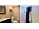 Cozy bathroom features a tiled shower, modern vanity, and neutral decor, creating a relaxing atmosphere at 3630 White Pine Ct # 138, Sarasota, FL 34238