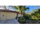 Charming home with a tile roof, attached garage, and lush landscaping for added curb appeal at 3630 White Pine Ct # 138, Sarasota, FL 34238