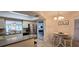 Bright kitchen featuring stainless steel appliances, breakfast bar, and adjacent dining area at 3630 White Pine Ct # 138, Sarasota, FL 34238