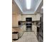 Well-lit kitchen with stainless steel appliances and plenty of storage space at 3630 White Pine Ct # 138, Sarasota, FL 34238