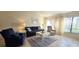 Bright living room with tile floors, furniture and natural light at 3630 White Pine Ct # 138, Sarasota, FL 34238