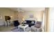 Comfortable living room featuring a ceiling fan, dining area, and tile floors at 3630 White Pine Ct # 138, Sarasota, FL 34238