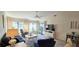 Open living room with tile floors, furniture and a large television at 3630 White Pine Ct # 138, Sarasota, FL 34238