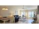 Living room with tile floor, ceiling fan, and sliding glass door at 3630 White Pine Ct # 138, Sarasota, FL 34238
