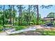Outdoor picnic and grilling area, featuring multiple tables, providing a perfect space for neighborhood gatherings at 3630 White Pine Ct # 138, Sarasota, FL 34238