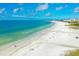 Expansive aerial view of Siesta Key beach with clear turquoise water and white sand, perfect for relaxation at 3977 Roberts Point Rd, Sarasota, FL 34242