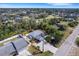 A real estate aerial view showcases a charming neighborhood, highlighting the property's prime location and curb appeal at 4661 Alligator Dr, Venice, FL 34293