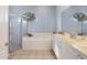 Bathroom showcasing a soaking tub, glass shower, and double sink vanity at 4705 Sweetmeadow Cir, Sarasota, FL 34238