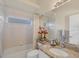 Traditional bathroom with a tiled shower and granite vanity at 4705 Sweetmeadow Cir, Sarasota, FL 34238