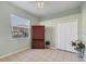Bedroom featuring tile floors, a ceiling fan, and views of the lanai at 4705 Sweetmeadow Cir, Sarasota, FL 34238