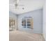 Light-filled bedroom with carpeting and sliding glass doors to the screened outdoor space at 4705 Sweetmeadow Cir, Sarasota, FL 34238