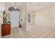 Bright foyer with tile flooring and transom windows at 4705 Sweetmeadow Cir, Sarasota, FL 34238