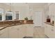 Kitchen counter overlooks breakfast nook, featuring a view to the backyard at 4705 Sweetmeadow Cir, Sarasota, FL 34238
