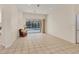 Bright living room with sliding glass doors to the pool and comfortable furnishings at 4705 Sweetmeadow Cir, Sarasota, FL 34238