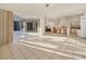 Open concept space features tile flooring and access to the screened outdoor living area at 4705 Sweetmeadow Cir, Sarasota, FL 34238