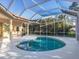 Lovely pool area with enclosure, perfect for enjoying outdoor swims and relaxation in a private setting at 4705 Sweetmeadow Cir, Sarasota, FL 34238