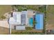 Overhead aerial shot of the home featuring a private pool, patio, large detached garage, and well-kept landscaping at 5002 Bunyan St, Sarasota, FL 34232