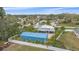 A beautiful aerial view of the property with a large detached garage and white fencing at 5002 Bunyan St, Sarasota, FL 34232