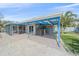 Back patio offers a covered space for dining or lounging in the shade at 5002 Bunyan St, Sarasota, FL 34232