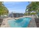 Stunning backyard pool with a screened-in patio and lush landscaping, creating a private outdoor retreat at 5002 Bunyan St, Sarasota, FL 34232