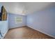 Cozy bedroom with a ceiling fan, window view, and tiled flooring at 5002 Bunyan St, Sarasota, FL 34232