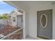 A covered entryway featuring a decorative front door, offering curb appeal at 5002 Bunyan St, Sarasota, FL 34232