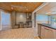 Kitchen bar area with wine cooler and countertop seating, and access to the backyard at 5002 Bunyan St, Sarasota, FL 34232