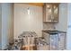 Kitchen nook with a counter seating area, cabinet with glass doors, and a wine cooler at 5002 Bunyan St, Sarasota, FL 34232