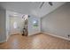 Inviting living room with wood-look flooring, a bright window, and a stylish front door at 5002 Bunyan St, Sarasota, FL 34232
