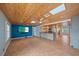 Spacious living room adjacent to the kitchen and featuring skylights and a modern media center at 5002 Bunyan St, Sarasota, FL 34232