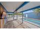 Inviting screened-in patio with access to a pool and backyard area, perfect for relaxation and outdoor activities at 5002 Bunyan St, Sarasota, FL 34232