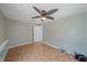 Room featuring tiled floors, ceiling fan and an interior door at 5002 Bunyan St, Sarasota, FL 34232