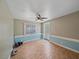 Room featuring tiled floors, ceiling fan, a window and exterior door at 5002 Bunyan St, Sarasota, FL 34232