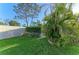 Well-manicured backyard with green lawn, privacy fence, manicured hedges and tropical landscaping at 503 Spring Lakes Blvd # 503, Bradenton, FL 34210
