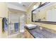 Bathroom featuring granite countertops and glass shower, designed for efficient space utilization at 503 Spring Lakes Blvd # 503, Bradenton, FL 34210