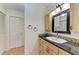 Bathroom with modern vanity, granite countertop, and convenient towel rings near the sink at 503 Spring Lakes Blvd # 503, Bradenton, FL 34210