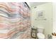 Bathroom featuring shower and toilet, enhanced with a stylish, decorative shower curtain at 503 Spring Lakes Blvd # 503, Bradenton, FL 34210