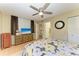Bedroom with ceiling fan, wooden floor, and floral-themed bedding, offering a cozy retreat at 503 Spring Lakes Blvd # 503, Bradenton, FL 34210