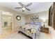 Bedroom with ceiling fan, wooden floor, and floral-themed bedding, offering a cozy retreat at 503 Spring Lakes Blvd # 503, Bradenton, FL 34210