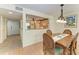 Dining area with wood table and chairs, open to the kitchen, with access to the outdoors at 503 Spring Lakes Blvd # 503, Bradenton, FL 34210