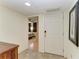 Hallway featuring tile flooring, view to bedroom, and a modern door at 503 Spring Lakes Blvd # 503, Bradenton, FL 34210