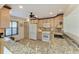 Kitchen featuring modern appliances and lots of counter space, tile backsplash, and many cabinets at 503 Spring Lakes Blvd # 503, Bradenton, FL 34210