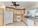 Kitchen featuring modern appliances and lots of counter space, tile backsplash, and many cabinets at 503 Spring Lakes Blvd # 503, Bradenton, FL 34210