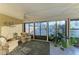 Relaxing sunroom with tile floors, large windows offering lots of natural light, ceiling fan and comfortable seating at 503 Spring Lakes Blvd # 503, Bradenton, FL 34210