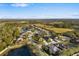 Aerial view of a residential neighborhood with ponds, trees, and well-maintained lawns at 5814 117Th E Ter, Parrish, FL 34219