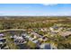 Aerial view of a residential area with houses surrounded by trees and water features at 5814 117Th E Ter, Parrish, FL 34219