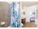 En-suite bathroom showcasing a tiled shower/tub combination and a doorway view into the main bedroom at 5814 117Th E Ter, Parrish, FL 34219