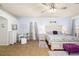 Spacious bedroom with calming tones, plush rug, accent furniture and natural light at 5814 117Th E Ter, Parrish, FL 34219