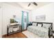 Spare bedroom decorated with coastal decor, featuring a daybed, TV, and serene ambiance at 5814 117Th E Ter, Parrish, FL 34219