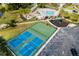Aerial view of community amenities including a pool, playground, and tennis and basketball courts at 5814 117Th E Ter, Parrish, FL 34219
